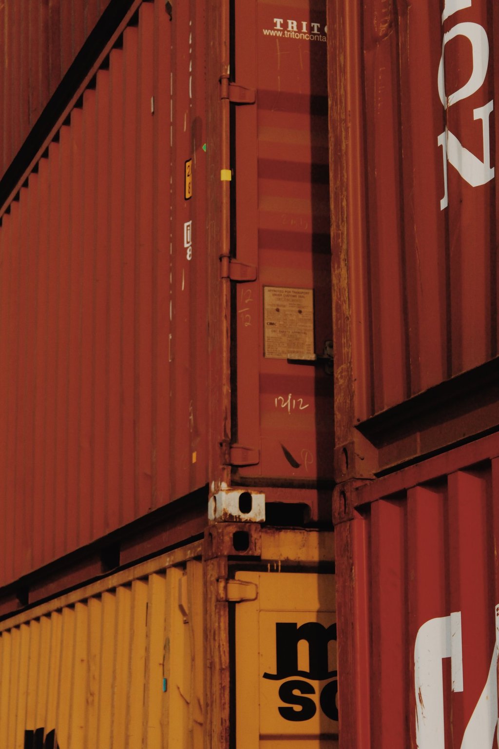 a group of containers stacked up in a row