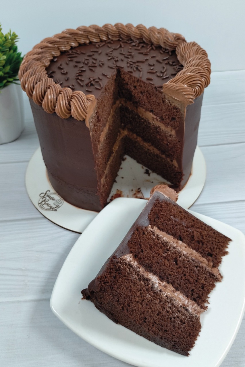 a chocolate cake with chocolate frosting and chocolate frosting