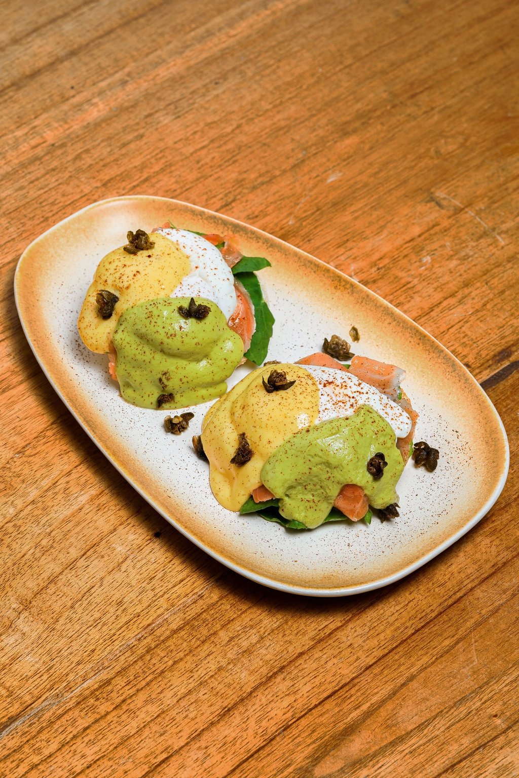 a plate of salmon egg benedict