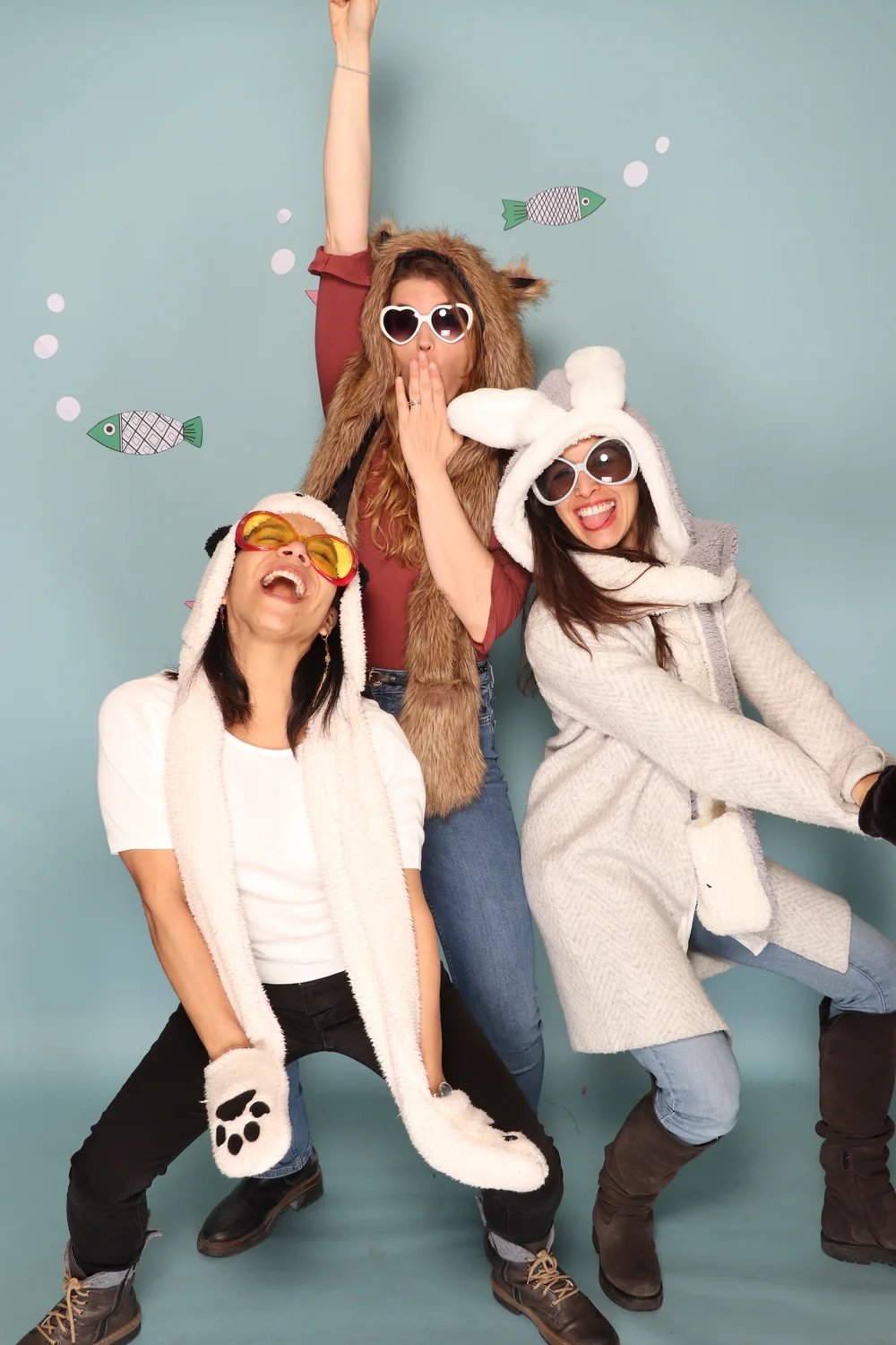 three women in animal print clothing posing for a photo