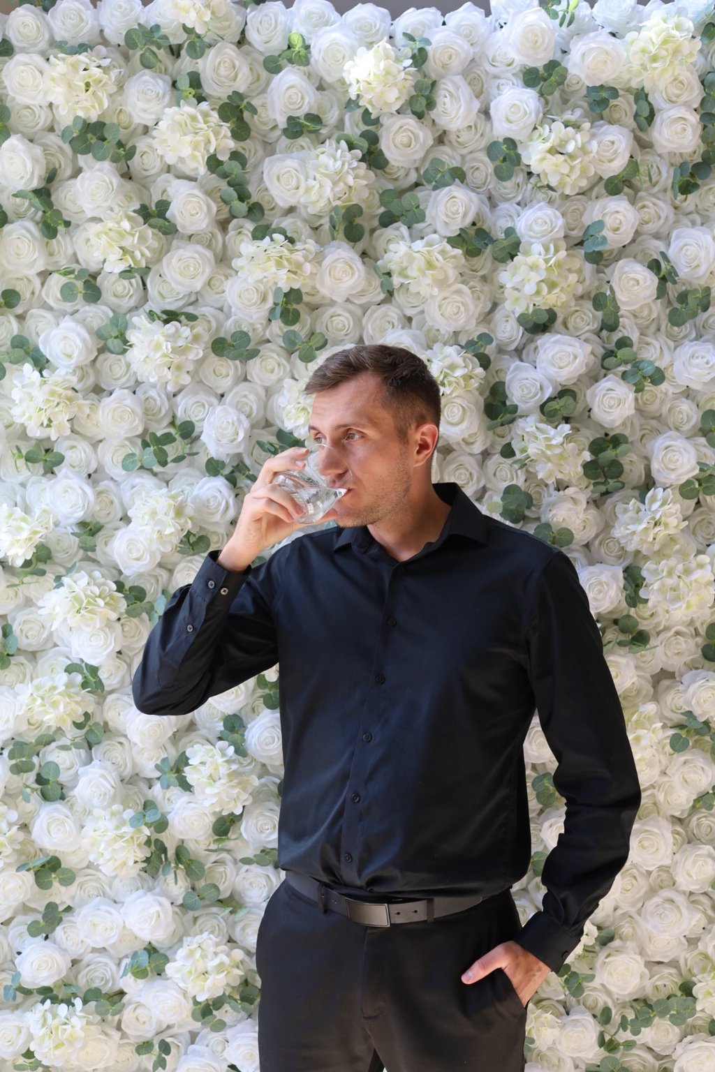 Event backdrop featuring a luxurious white rose flower wall rental in Shakopee, Minnesota
