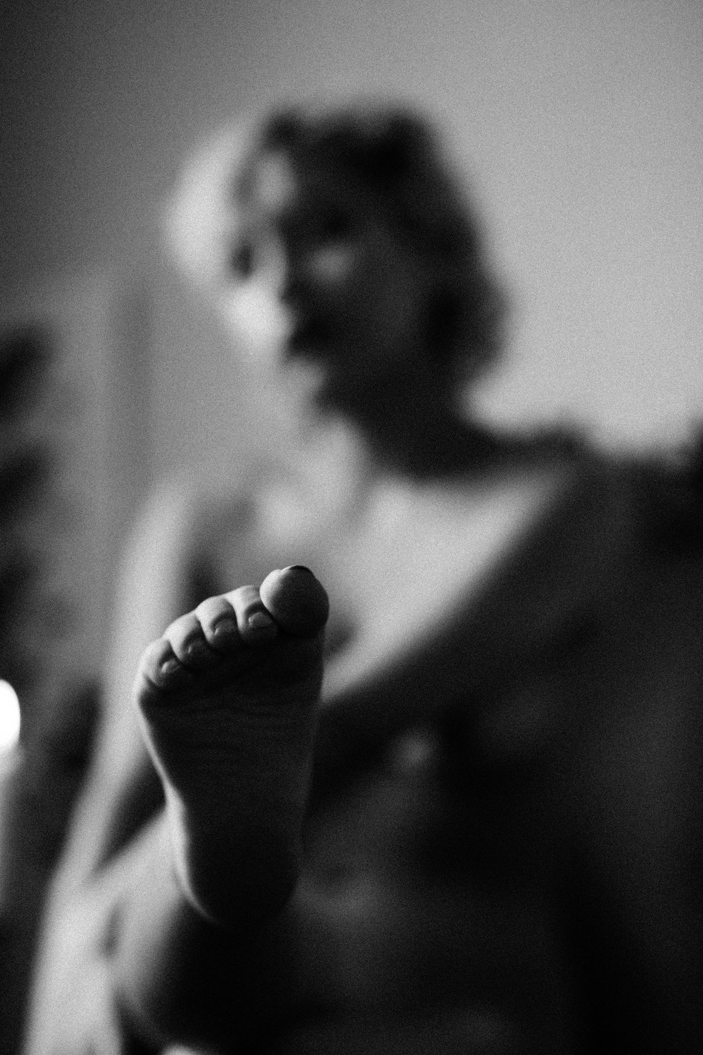 a woman's feet and toes are shown in black and white