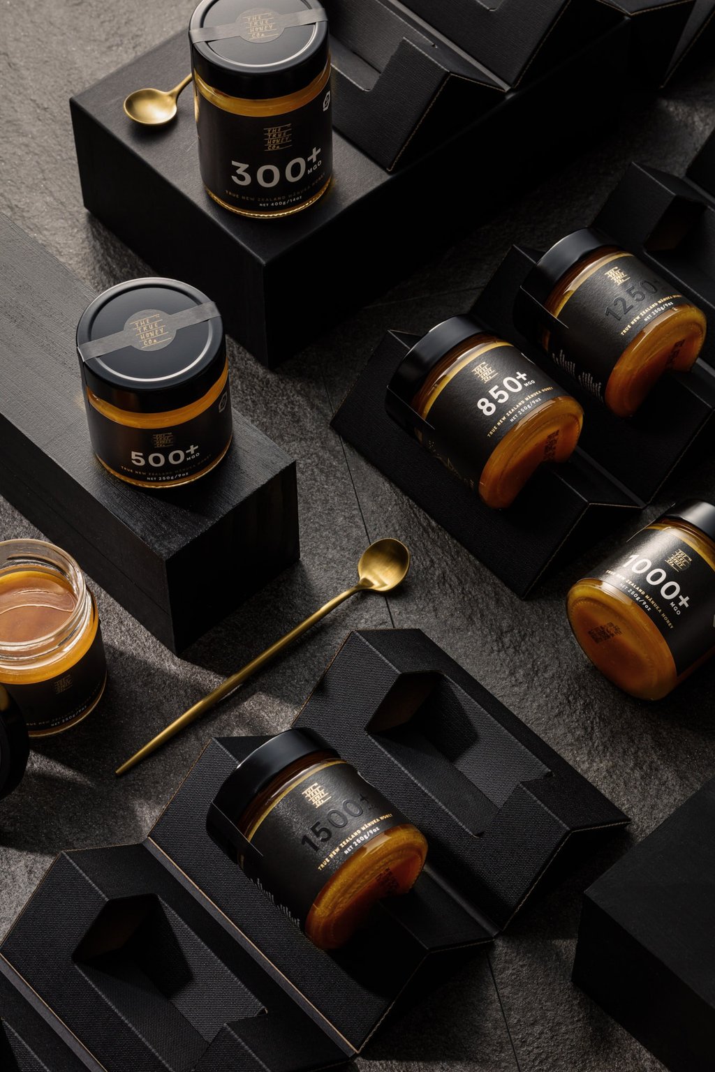 Product photography - a variety of jars of honey styled