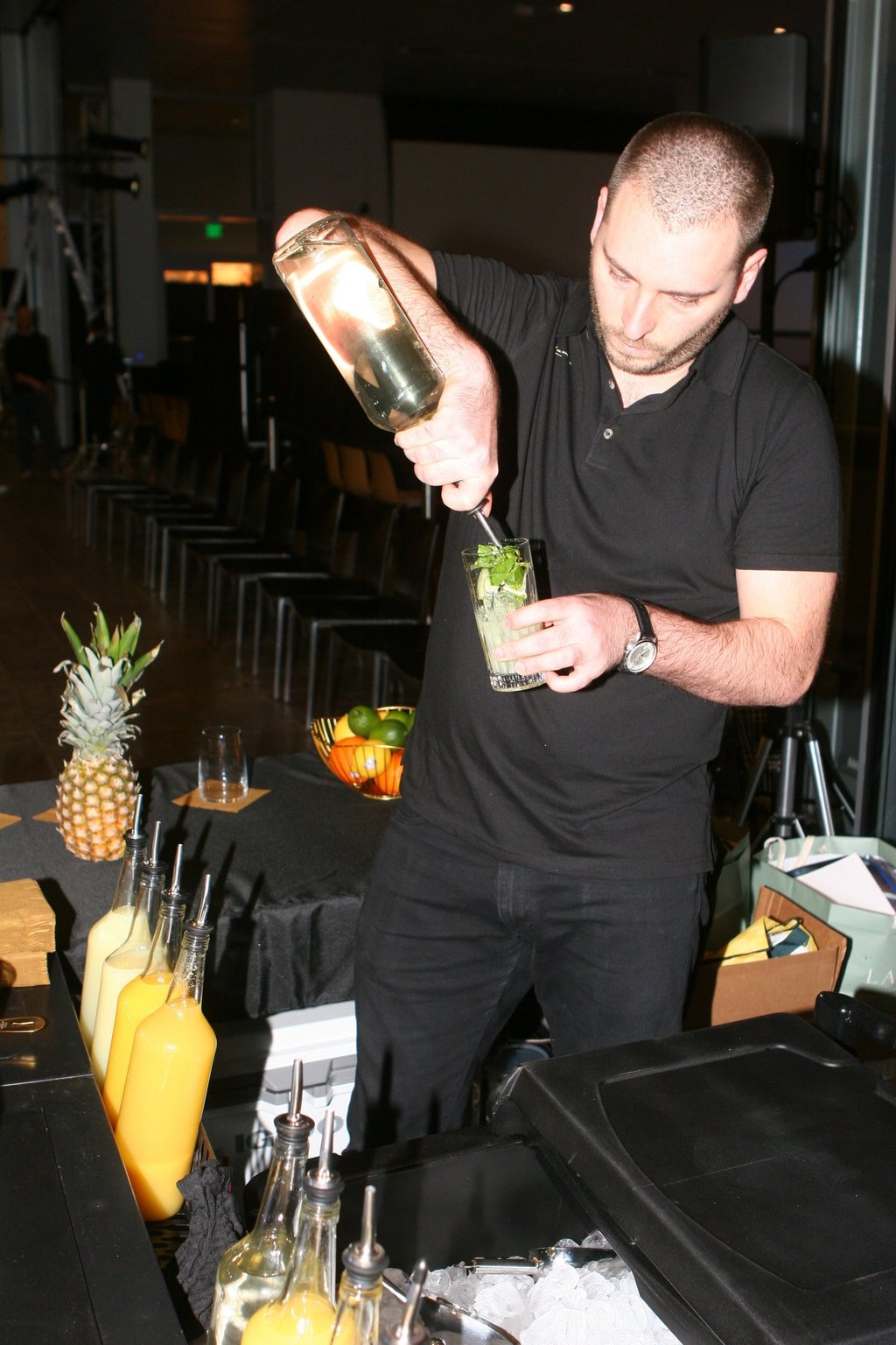 Master bartender pouring mixed drinks