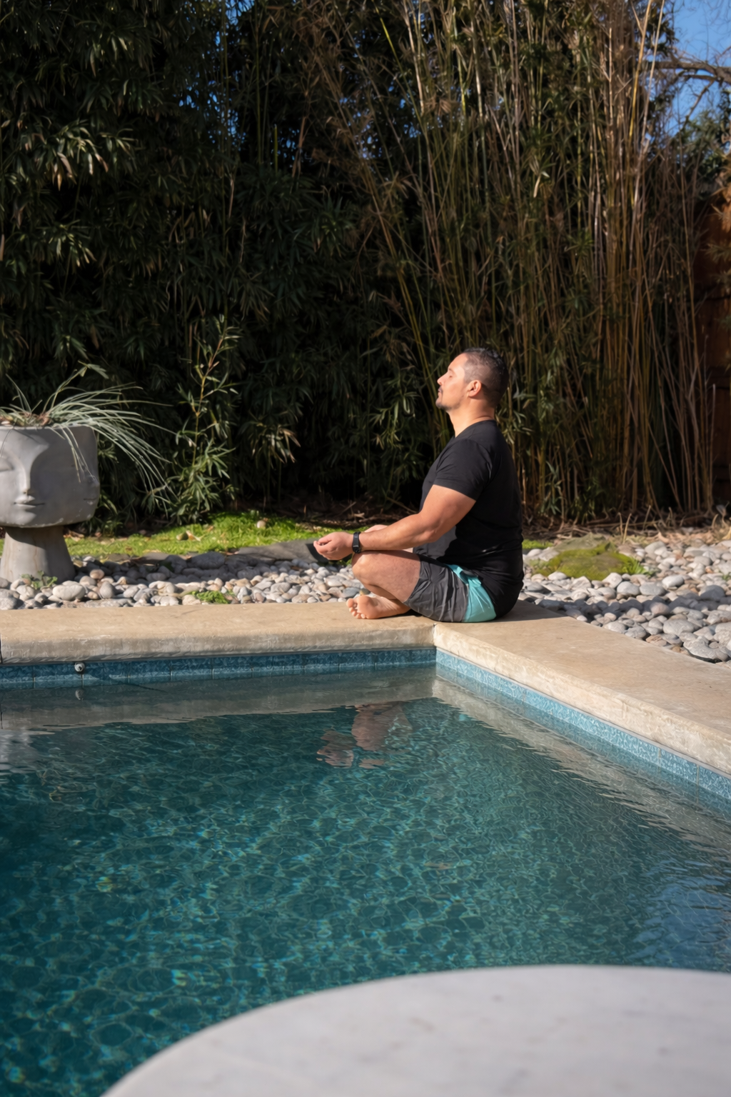 Man meditating by a pool representing calm, balance, and natural body support