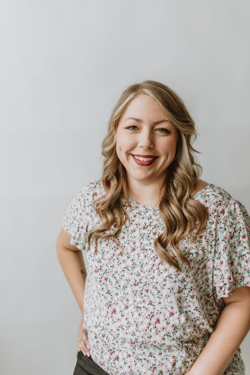 a woman smiling with blonde hair