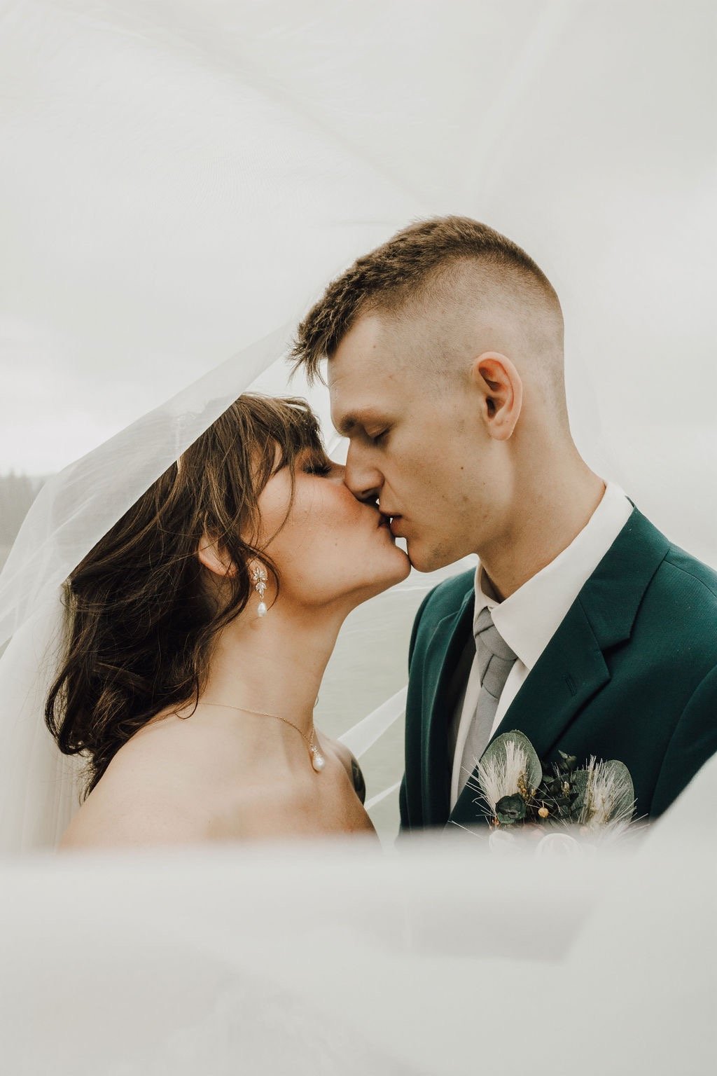 bride and groom portrait, kissing, under the veil shot