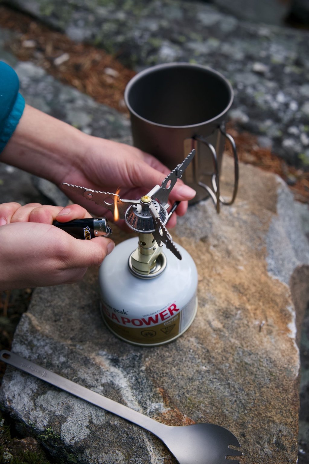 Snow Peak Titanium Backpacking Stove Being Lit With A Lighter