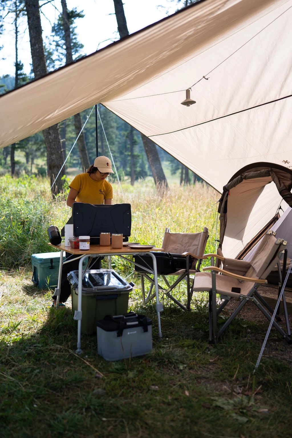 A woman cooking while camping