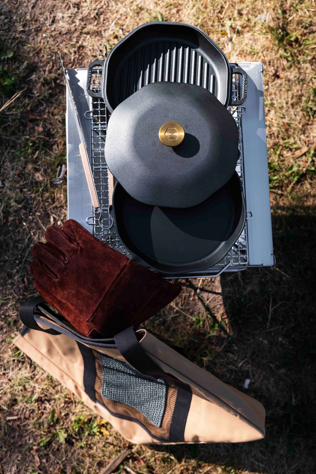 Wild Rover's Fire Cooking Upgrade Package. Cast Iron pan with Fire Gloves and a Snow Peak Takibi