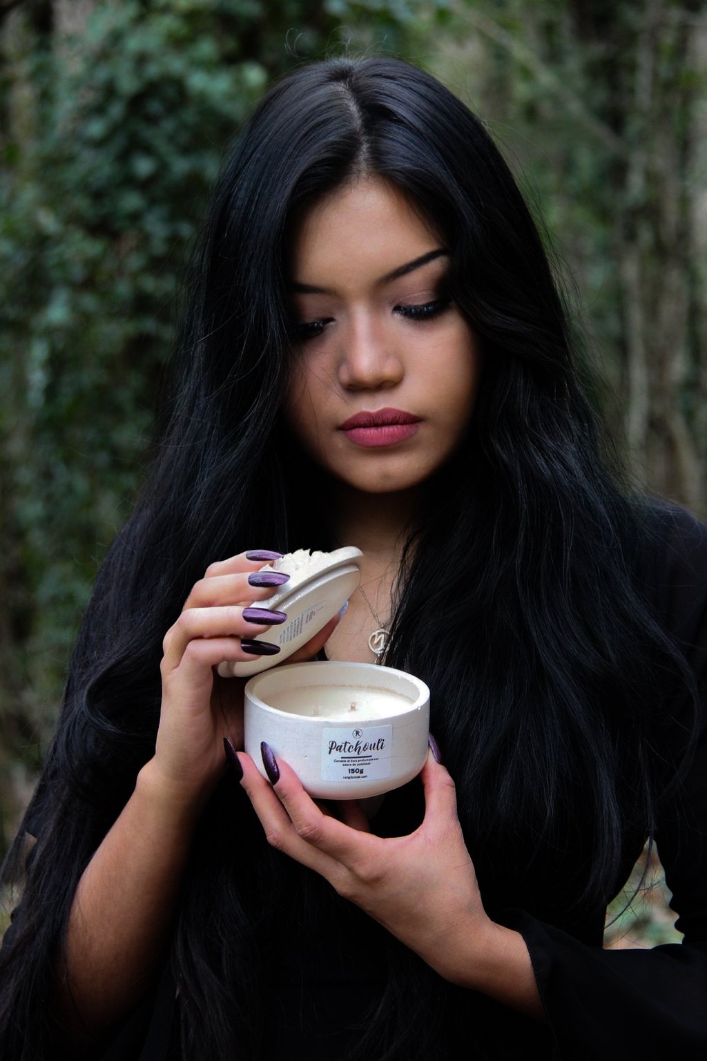 rangliciene showcasing her handmade scented soy candle