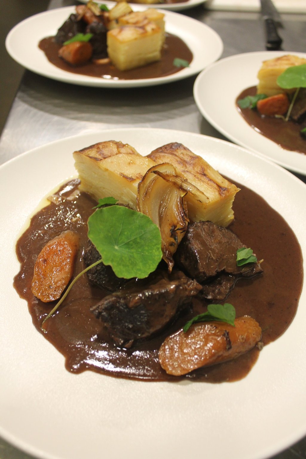 a plate of food with meat and vegetables