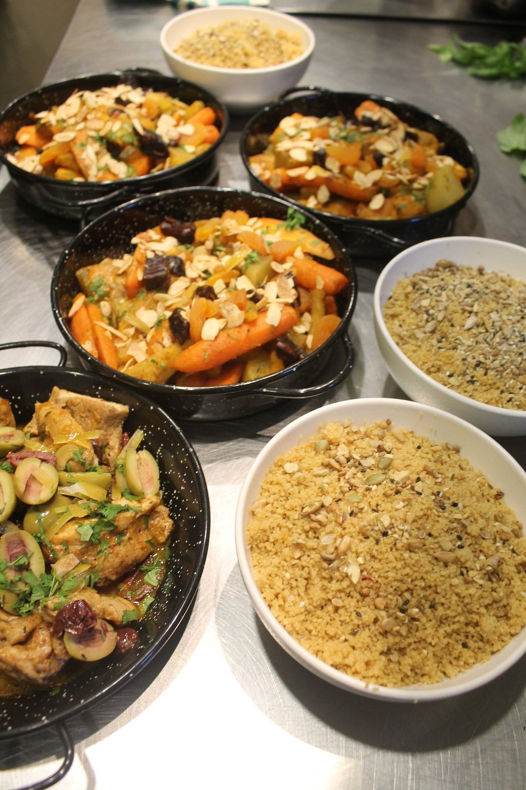 a table with bowls of mediterranean