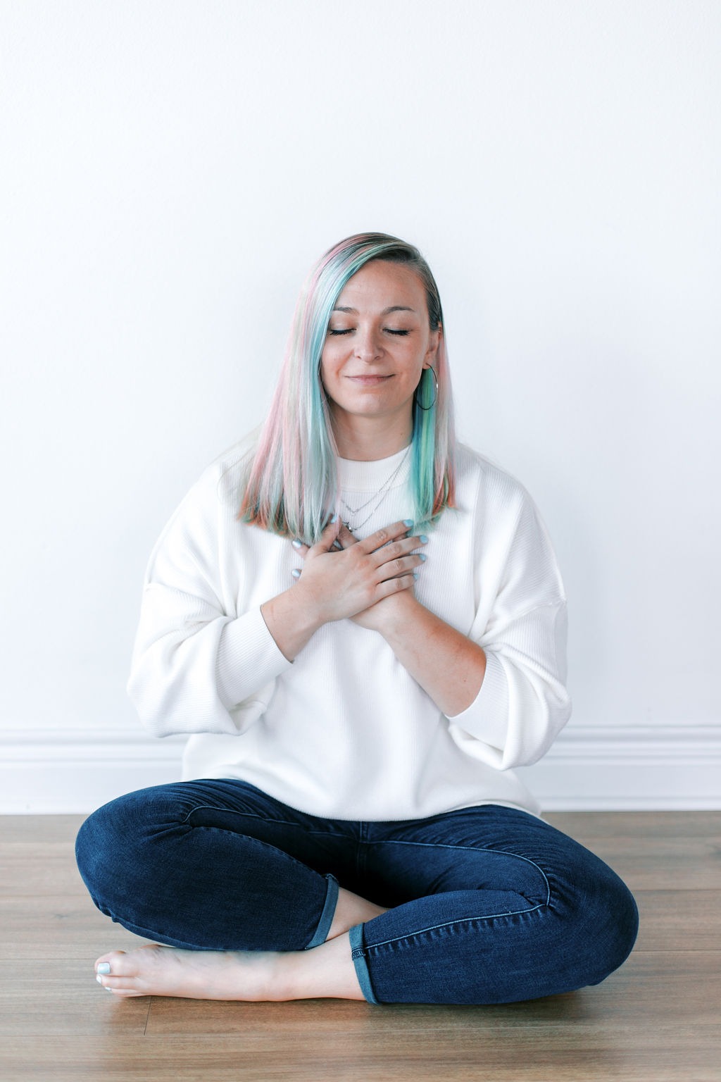 a woman with pastel hair and pastel blue and white hair