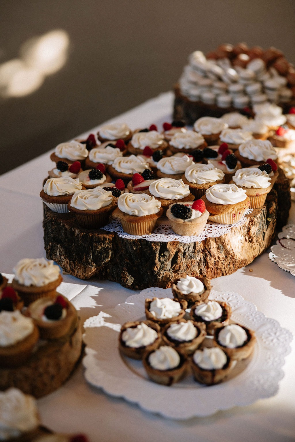 Selection of cupcakes shown as part of a rustic dessert bar in Bozeman Montana