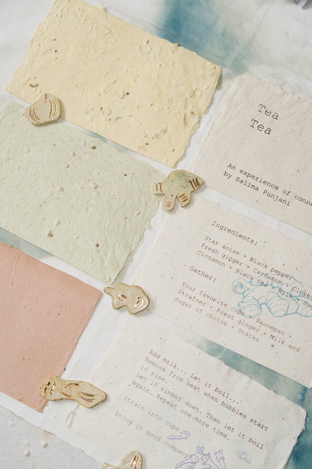 Handmade paper and ceramics. The paper has different chai spices in it.