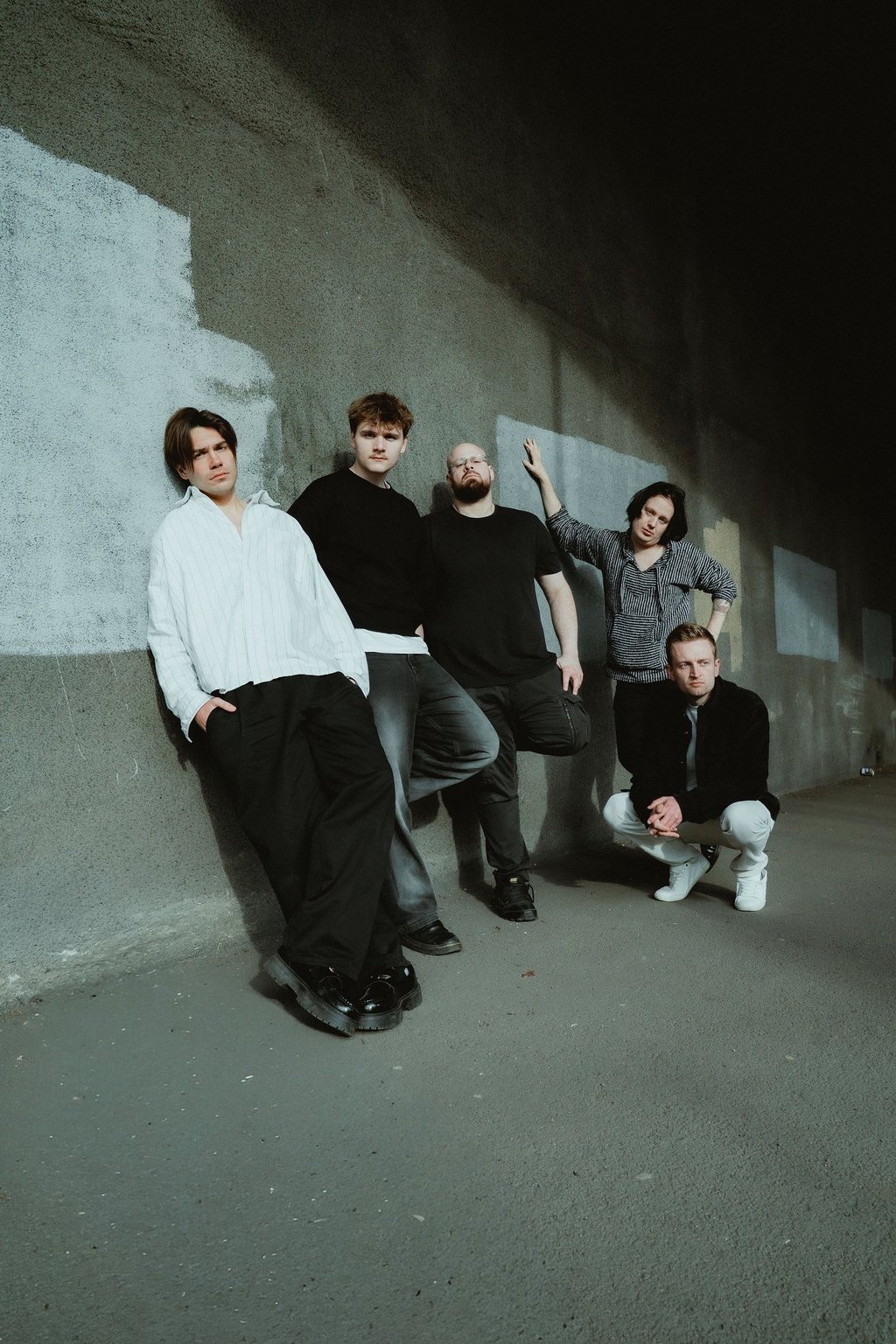 Lightlines band leaning along a wall