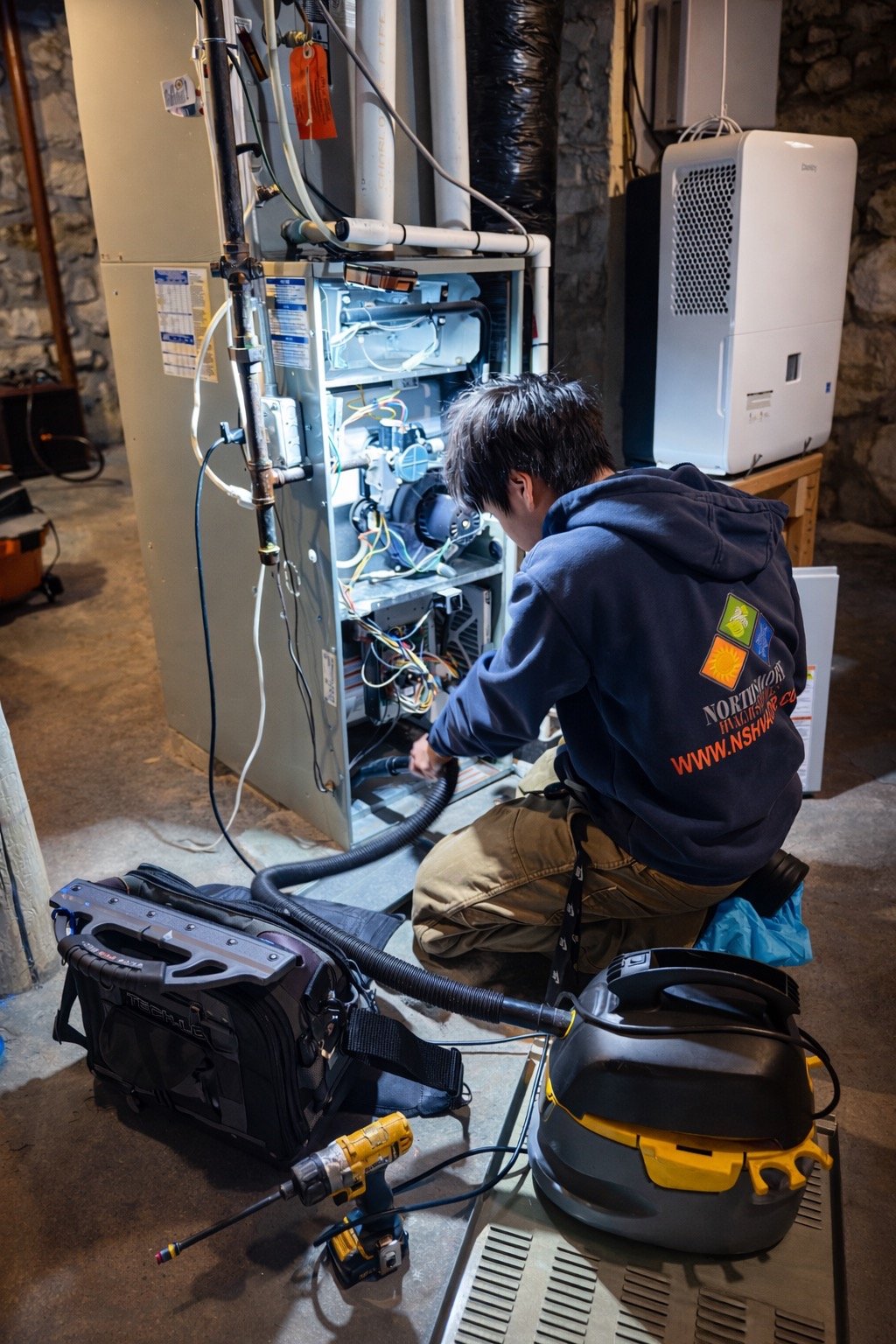 John A. is performing a heating maintenance on a furnace.