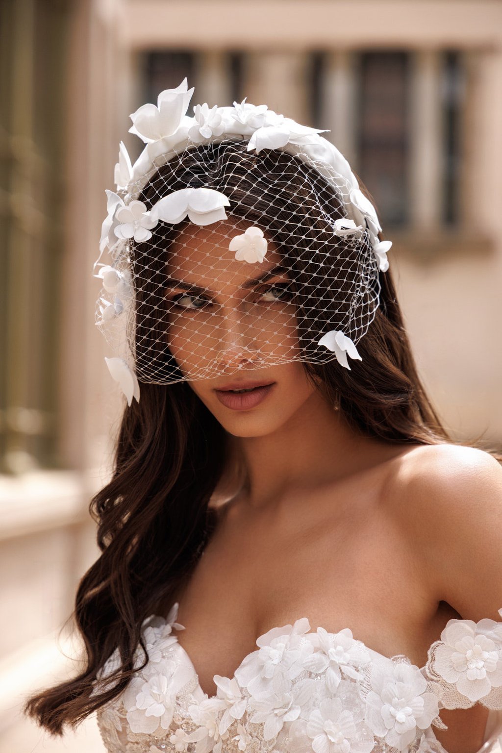a woman in a wedding dress with a veil and veil