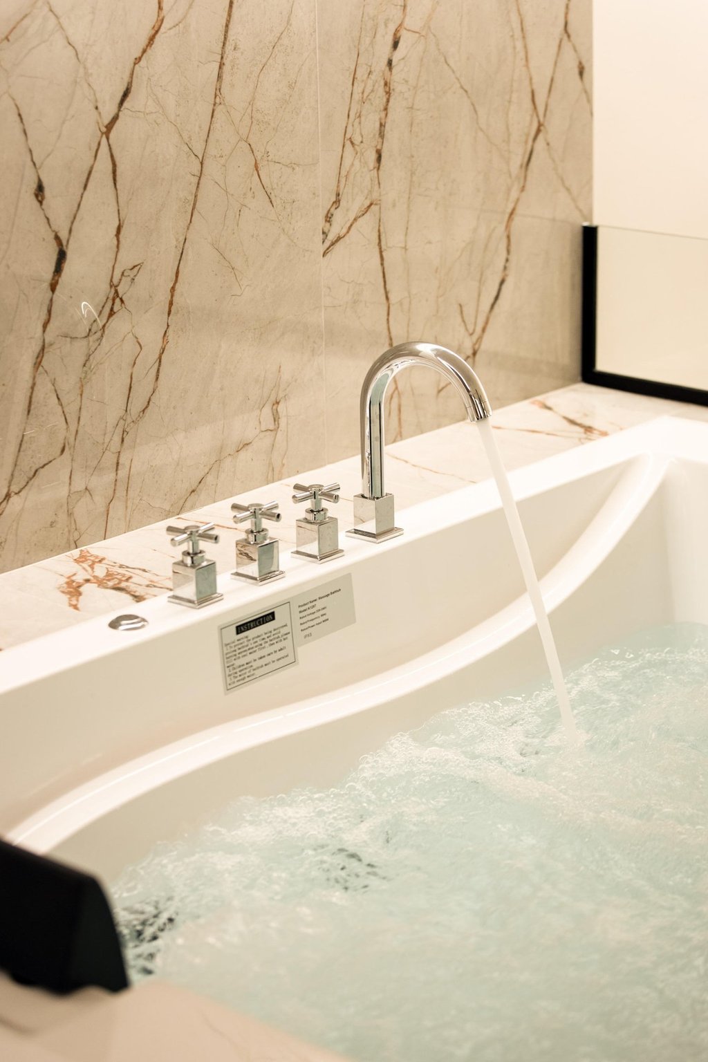 Upper floor - Double seated Jacuzzi with hydro massage feature overlooking the statue of Nike