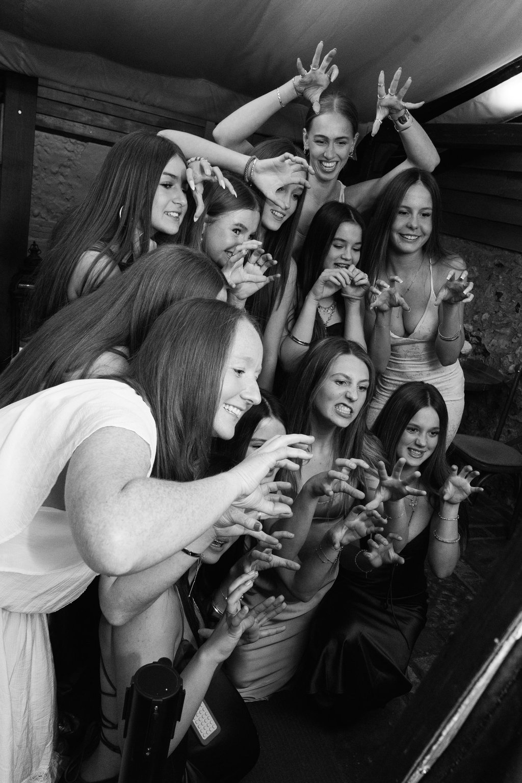 black and white image with women taking a self photograph
