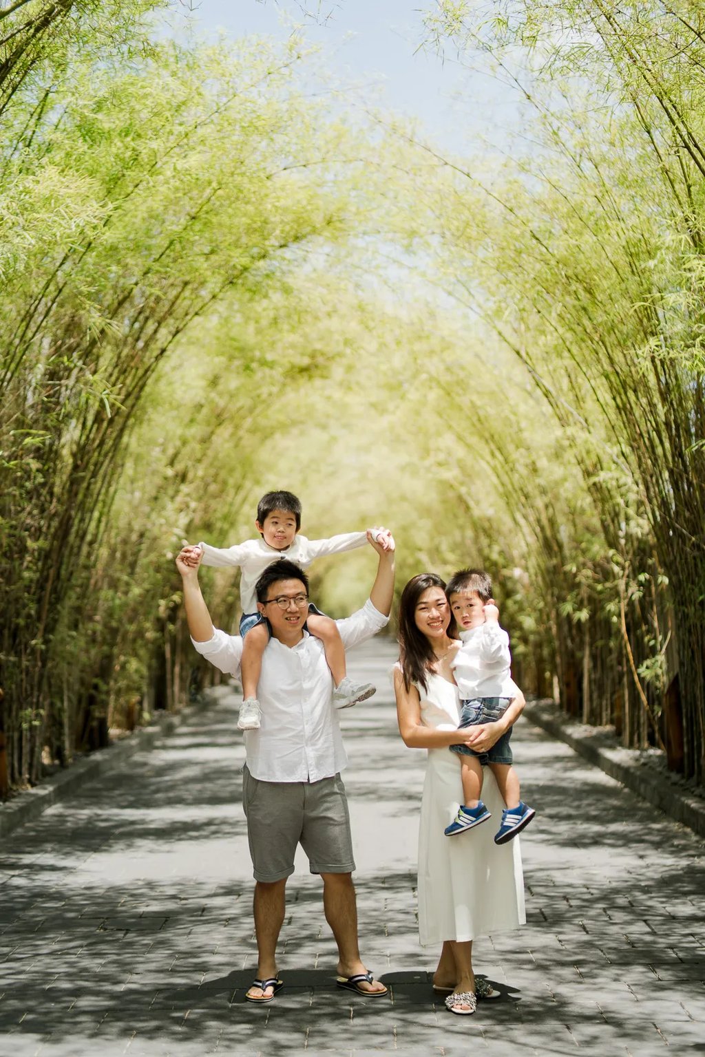 Playful family portrait during a natural family session at W Bali Seminyak