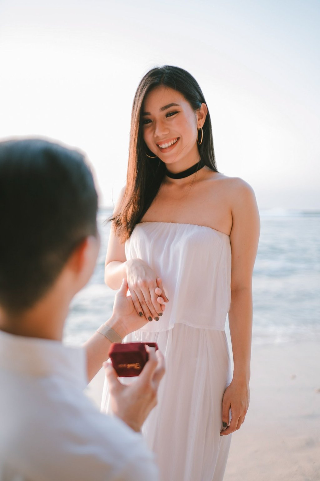 Man proposing on one knee during a couple photography session at Anantara Uluwatu Bali Resort.