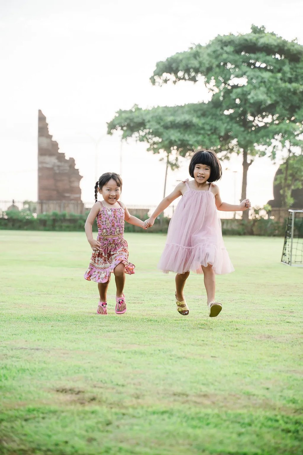 Children running together at Padma Resort Legian Bali during natural family photography session.