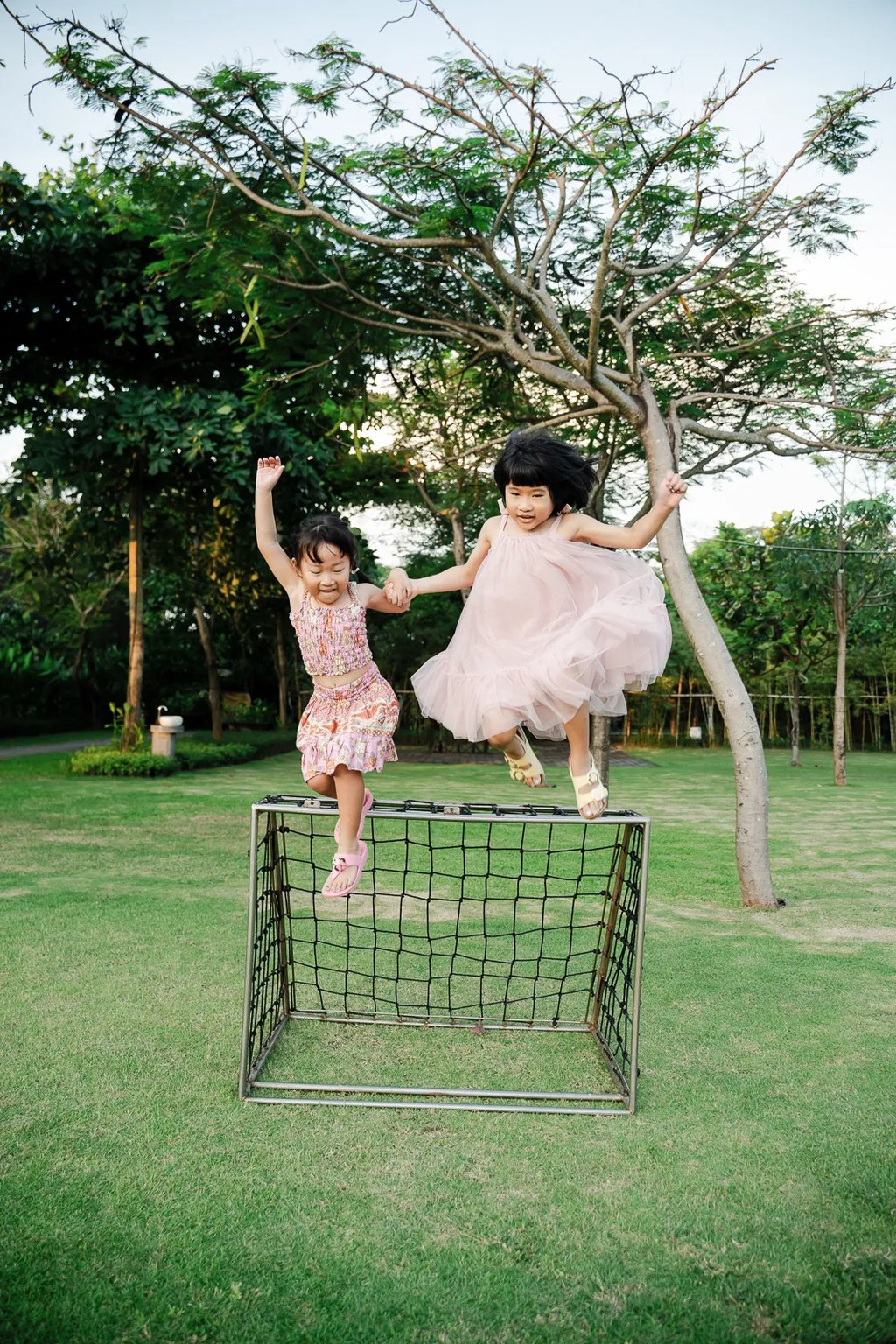 Children playing together at Padma Resort Legian Bali during relaxed family photography session.