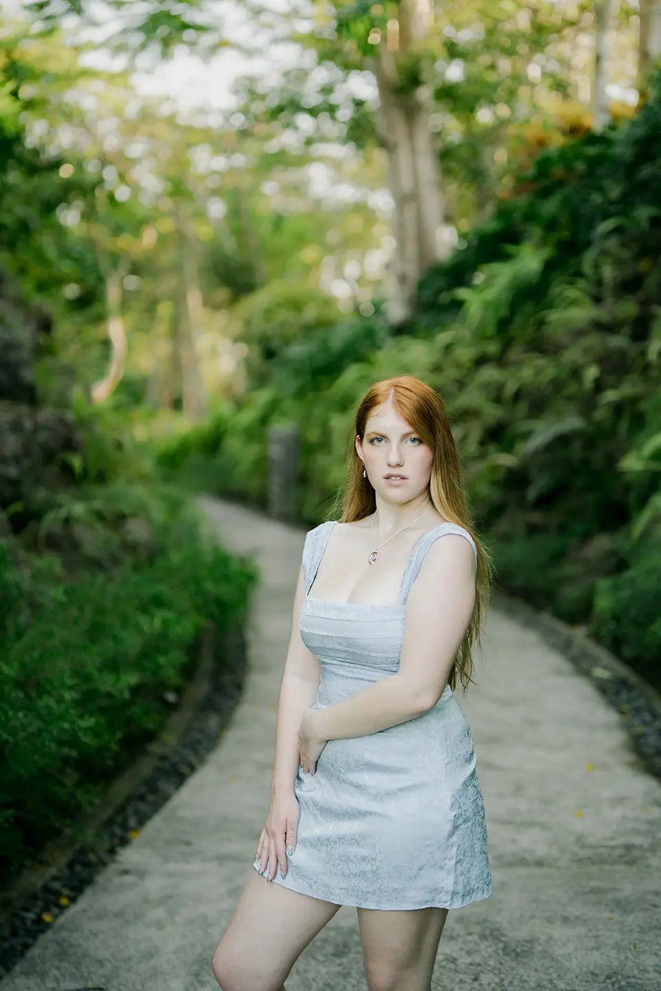 Mother portrait surrounded by tropical greenery during a family photography session at AYANA Resort Bali