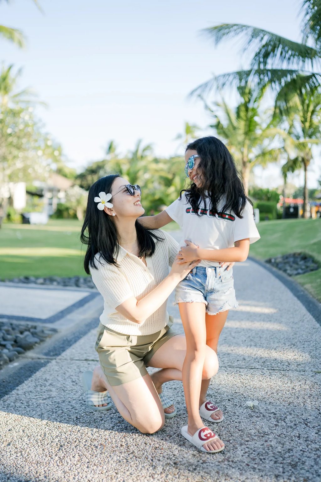 Mother and daughter sharing a joyful moment during a family photography session at InterContinental Bali Resort