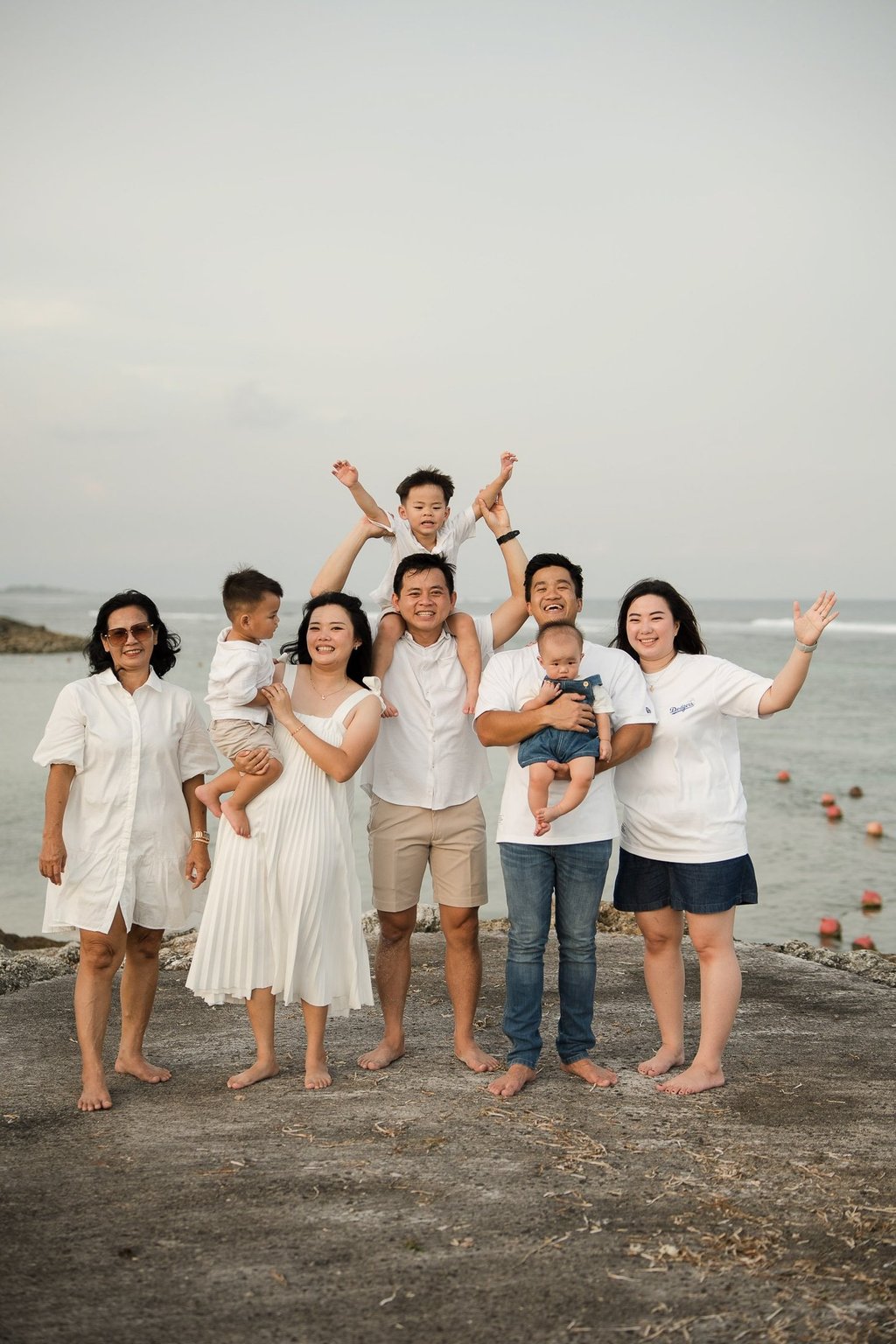 Multi generation family celebrating together during a Bali family photography session at The Apurva Kempinski Nusa Dua