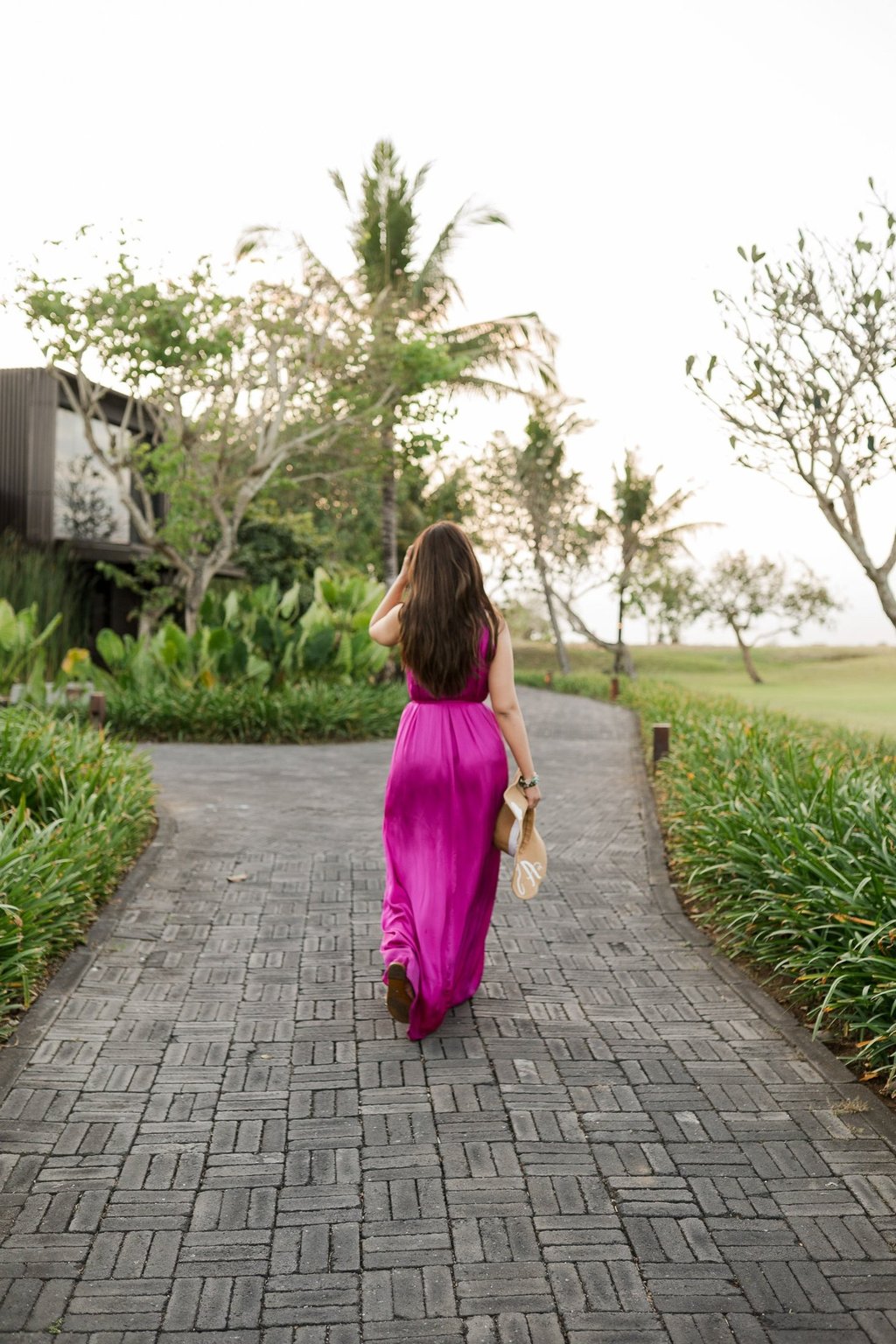 Portrait session walking through resort garden at Alila Soori Tabanan Bali