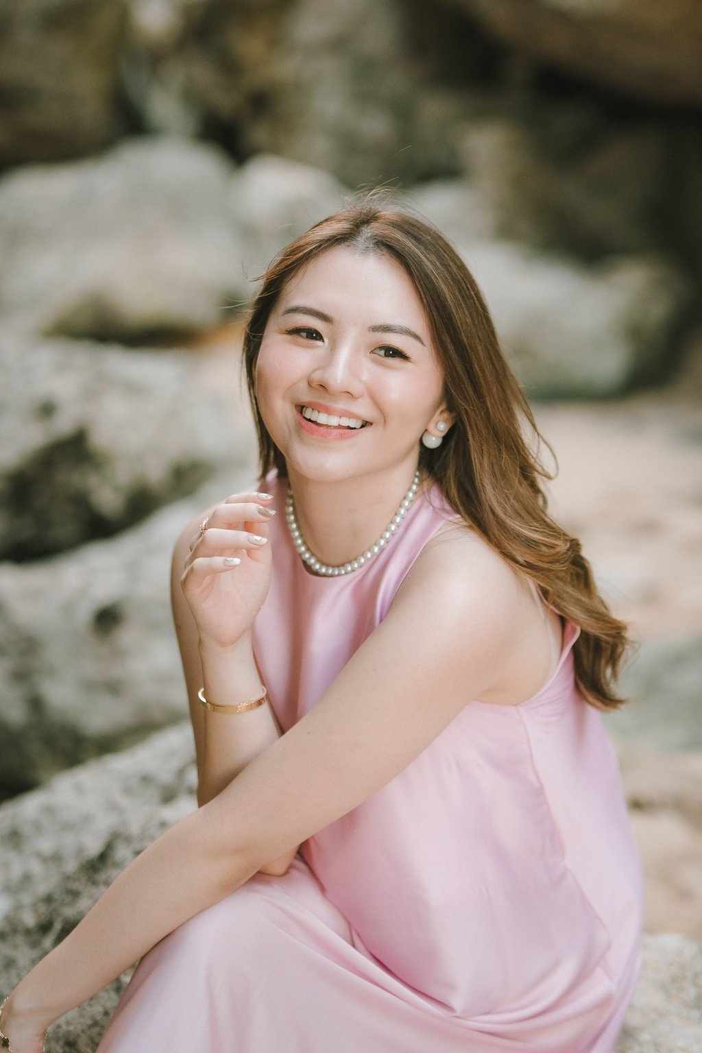 Smiling portrait of a woman during friends photoshoot at Geger Beach Nusa Dua Bali