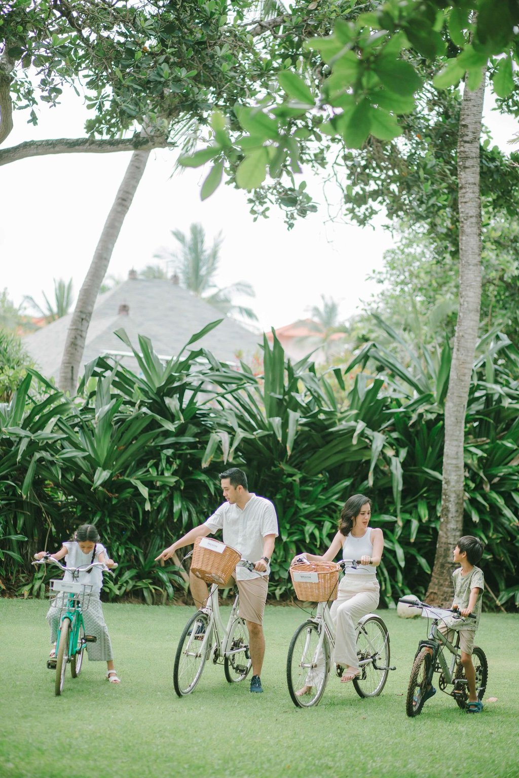 Family cycling session at The Westin Resort Nusa Dua Bali during morning light