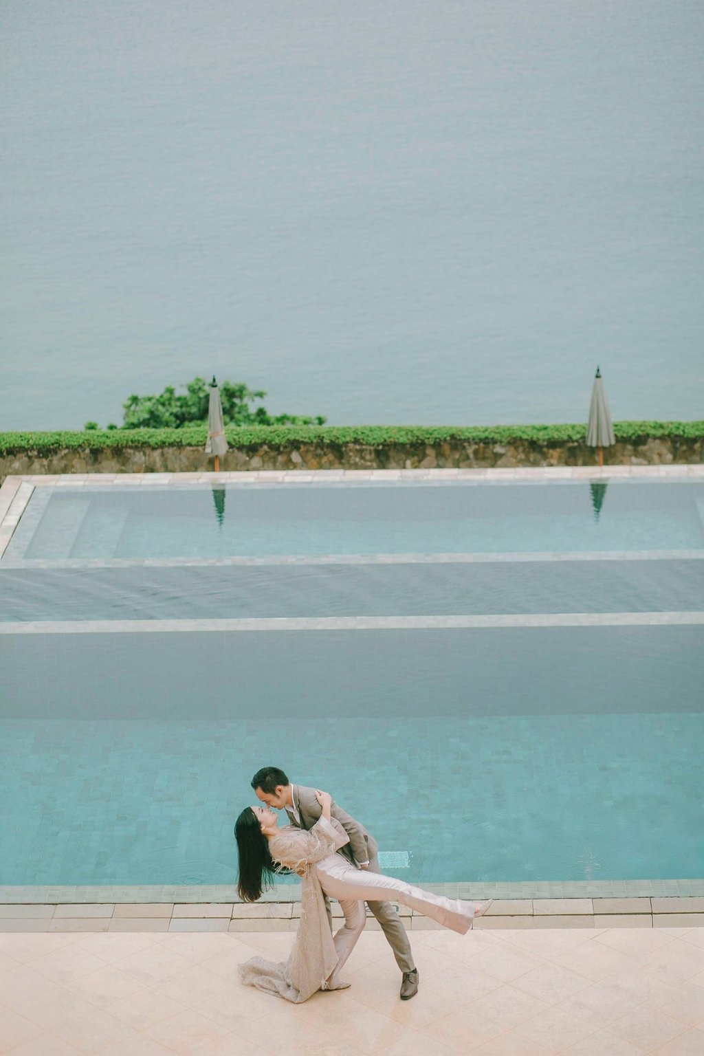 Romantic prewedding portrait by infinity pool at Amankila Karangasem Bali