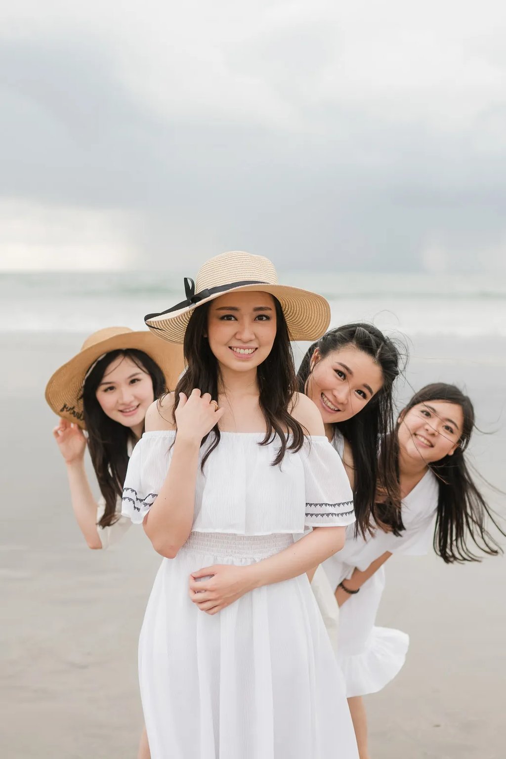 Multigeneration family portrait at Seminyak Beach Bali with joyful natural interaction during sunset family session.