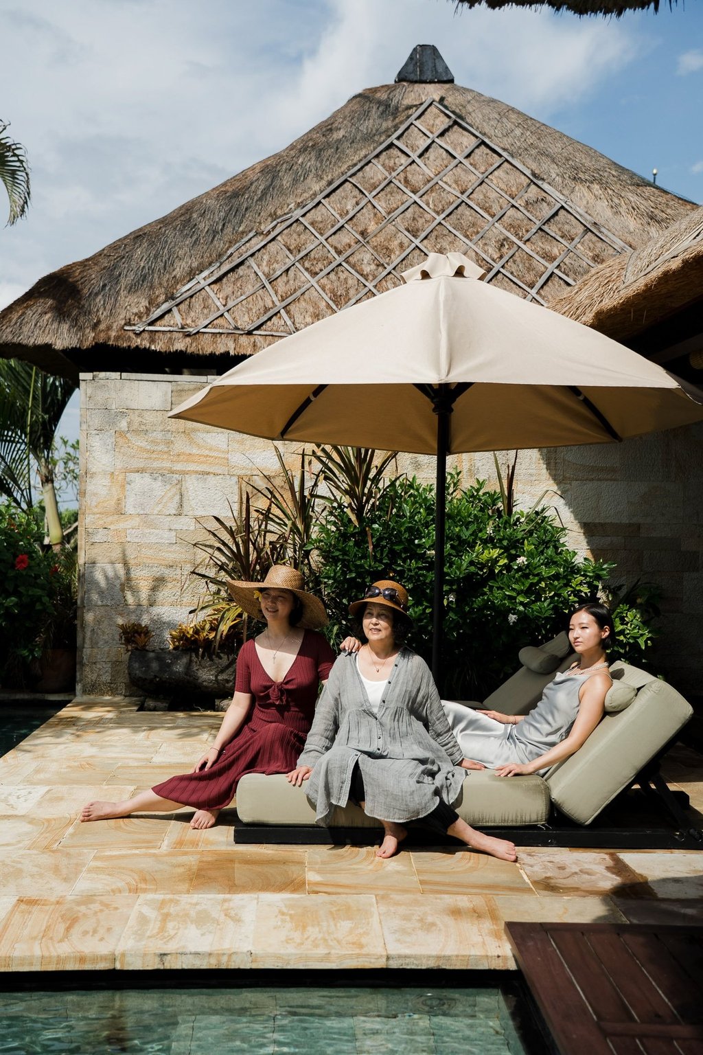 Family relaxing by private pool at Bvlgari Resort Uluwatu Bali, luxury villa family photography in Bali