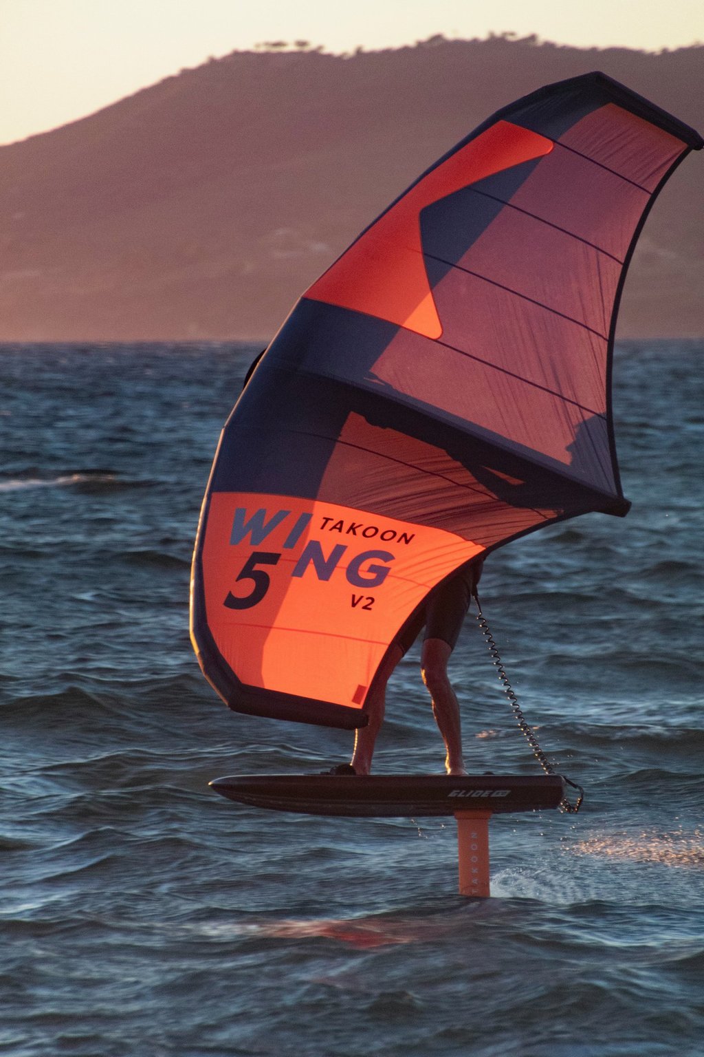 orange Wingfoil during sunset