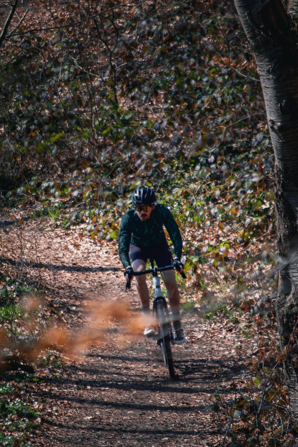 a man riding a bike on a trail