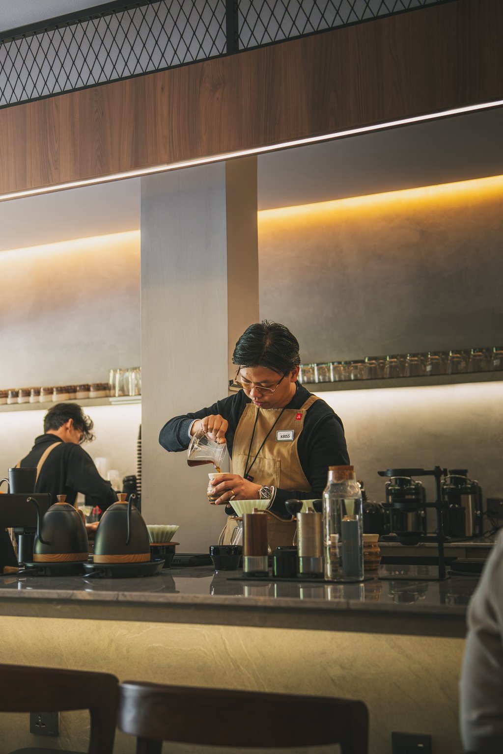 Barista making coffee at Grind Now Coffee Bar in Batam