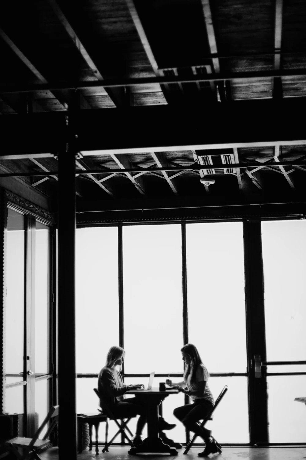 Two professionals working together on B2B strategy and market positioning.