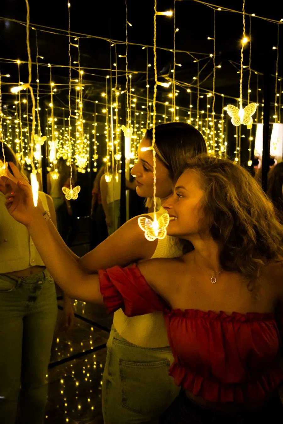 Colleagues bonding in an infinity light room during a creative corporate team building in Split.