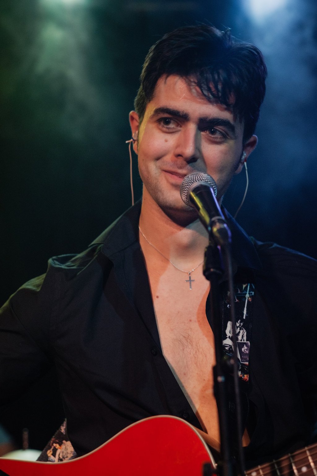 Olly Williams live rock and roll singer performing on stage