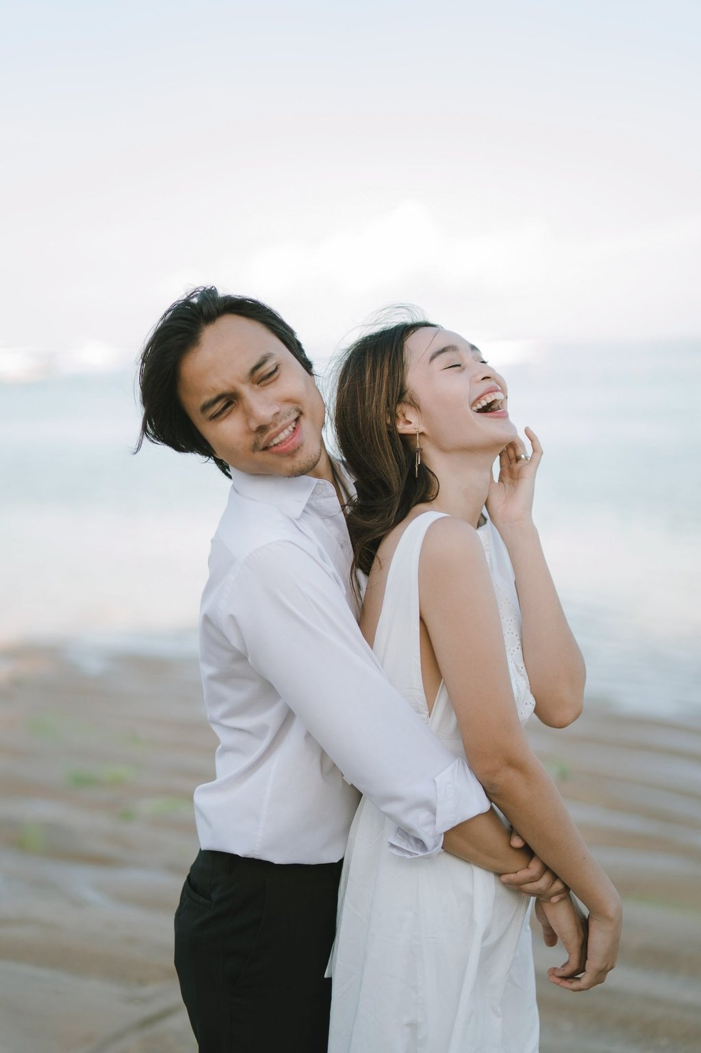 Romantic couple portrait by the beach during an intimate photography session at Novotel Bali Benoa in Tanjung Benoa Bali.