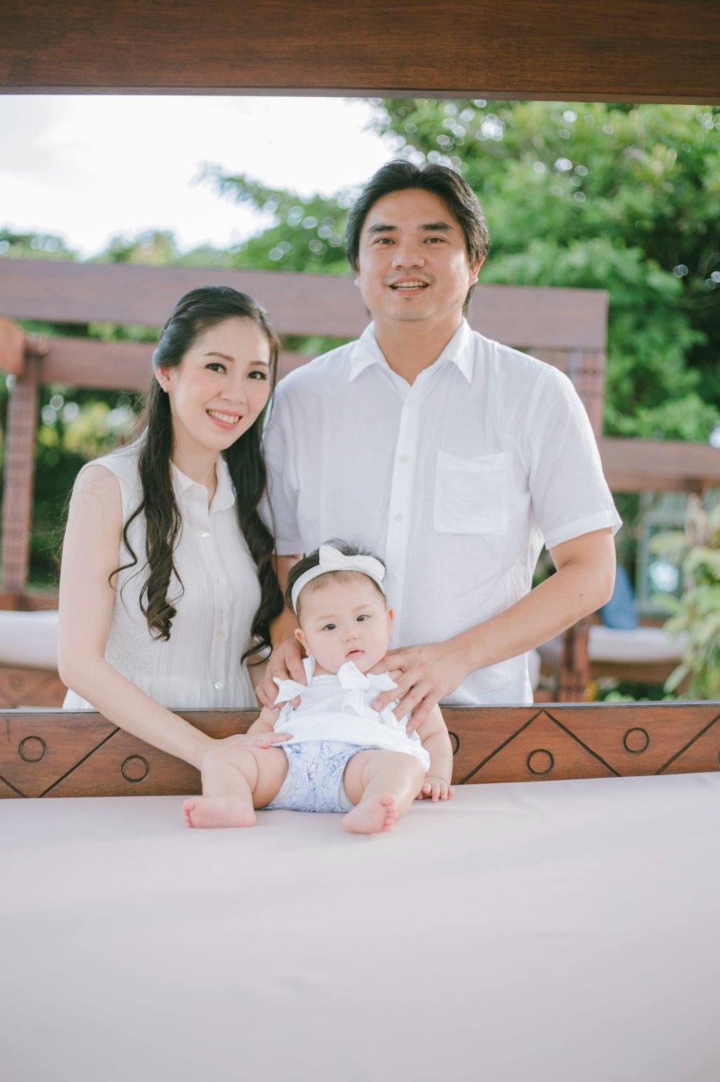 Family portrait with baby at balcony during Sofitel Nusa Dua Bali family photography session