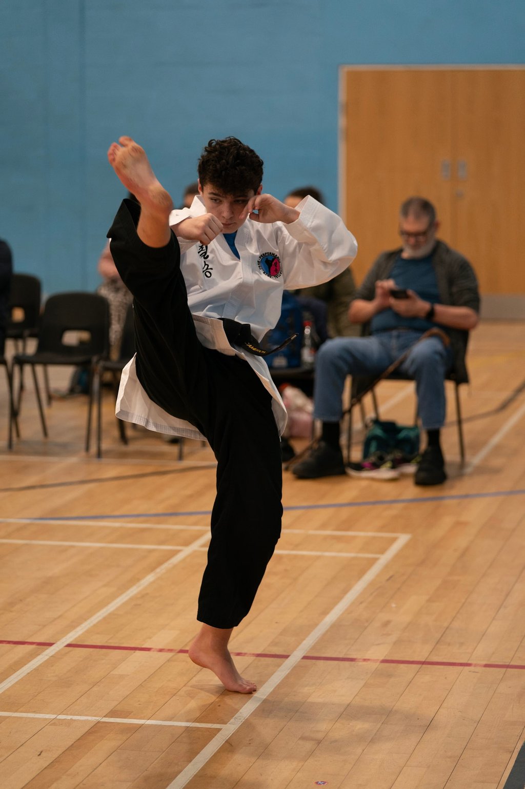 Black belt Junior practising kicks in our Tunbridge Wells classes.