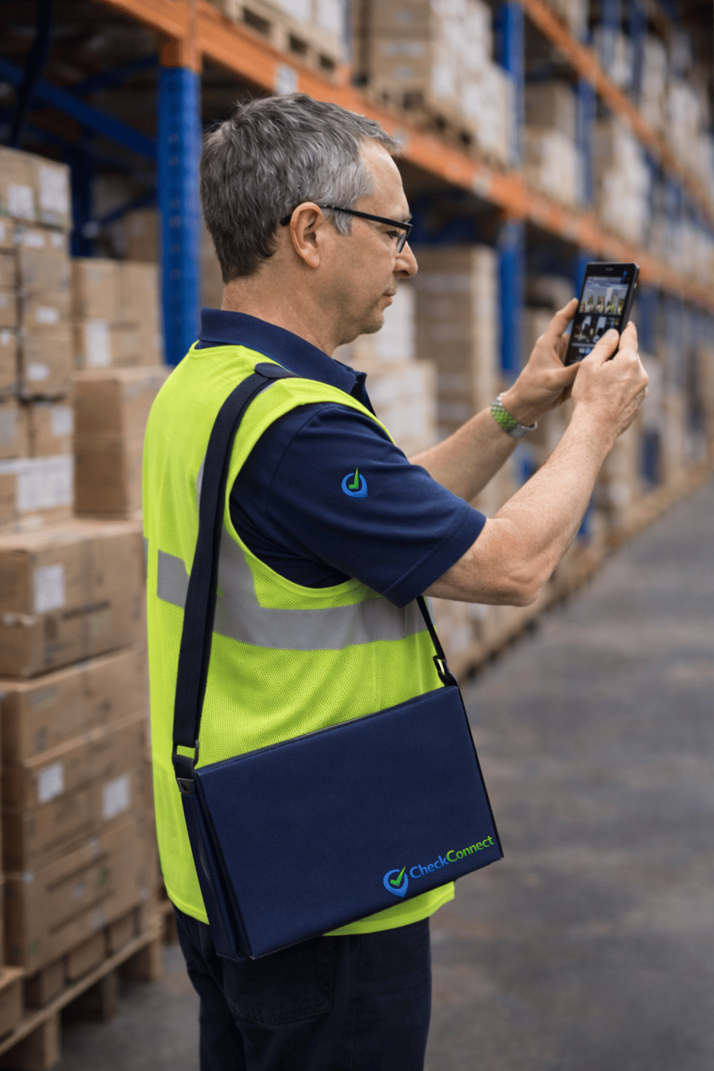 Man attending a warehouse and taking photos for the client