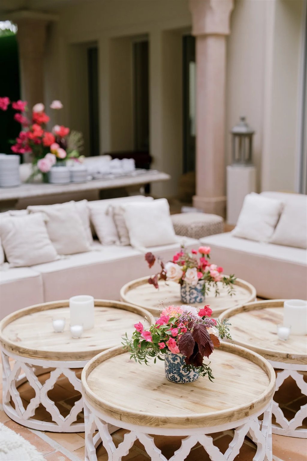 Wedding reception lounge with floral centrepieces