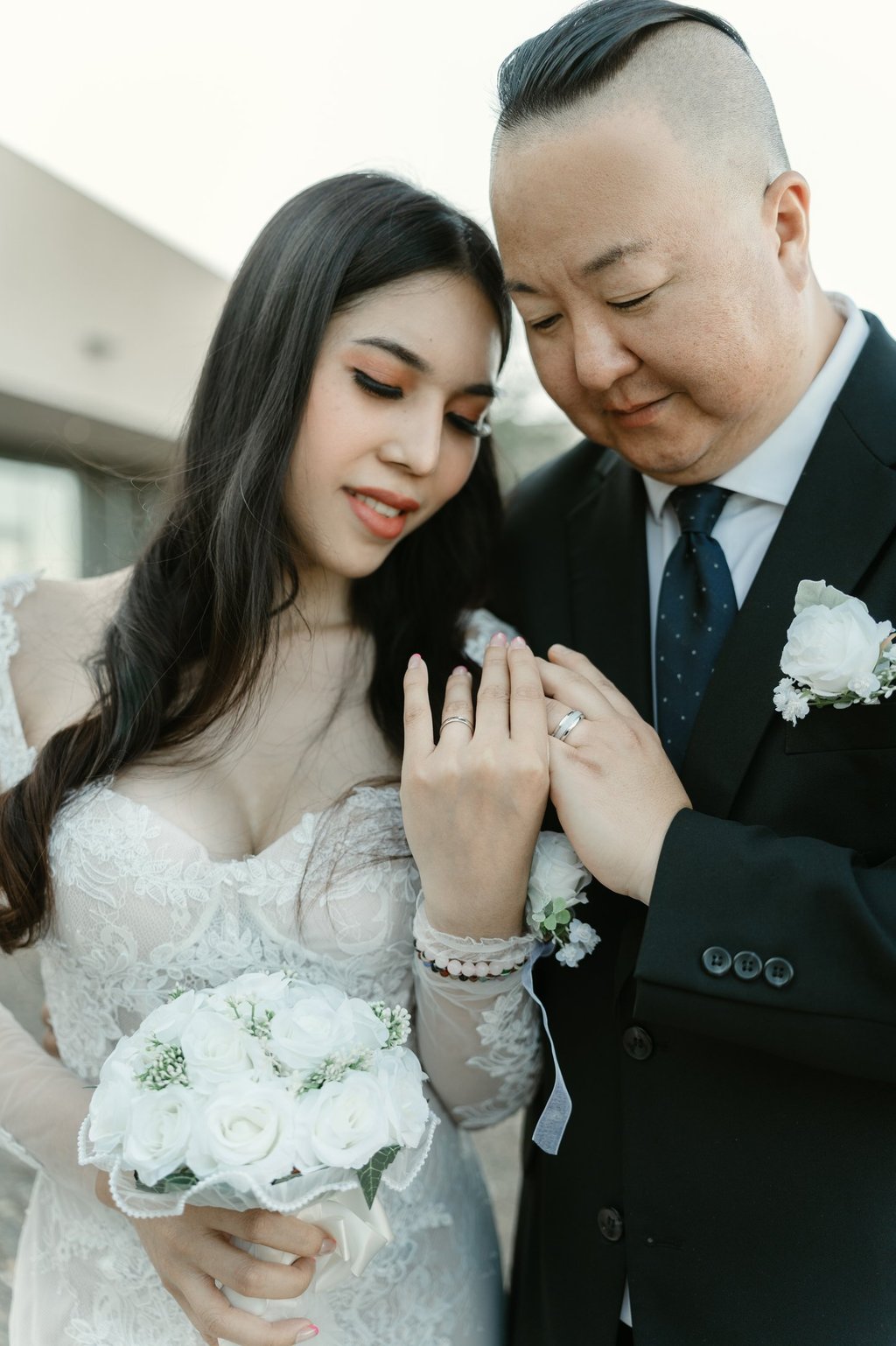 couple looking at thier rings